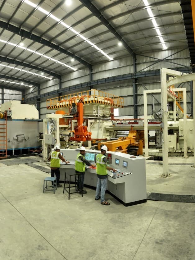Operators at the aluminium extrusion press control console